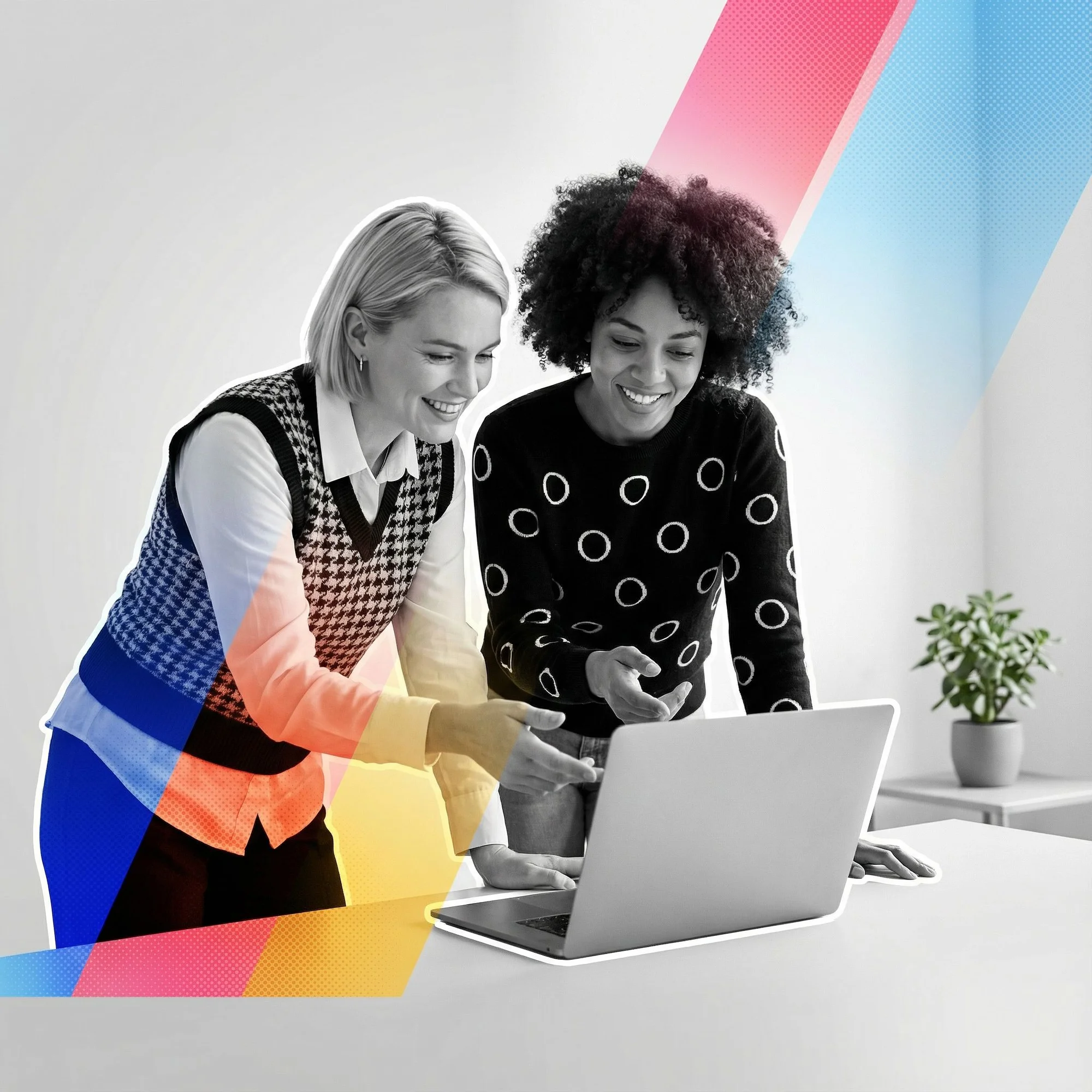 Two women collaborating on a laptop